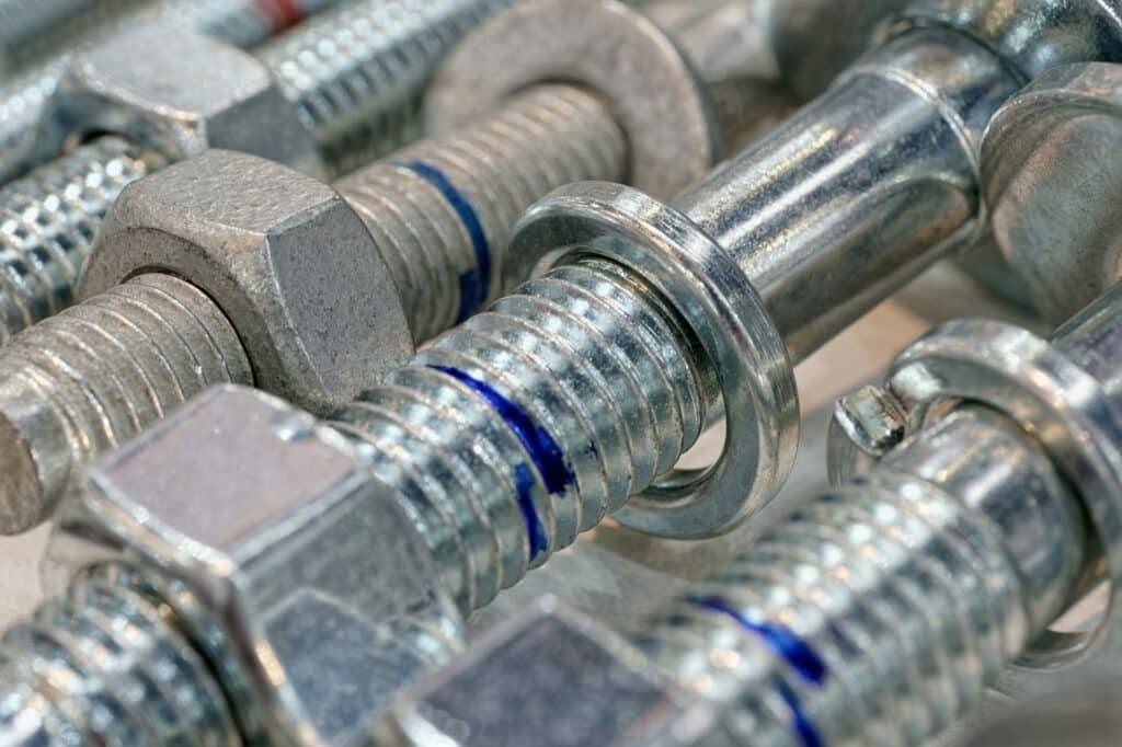 Group of galvanized screw-bolts with nuts and washers